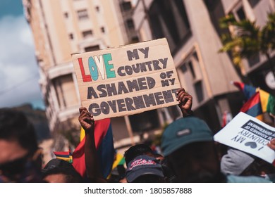 Port Louis, Mauritius - August 29, 2020: People holding signs in protest against the Mauritian government after recent oil spill and inaction