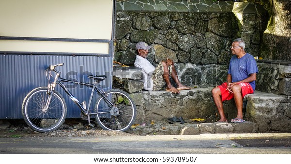 Port Louis,\
Mauritius - Jan 11, 2017. People chatting on street in Port Louis,\
Mauritius. Port Louis is the country economic, cultural, political\
centre and most populous\
city.