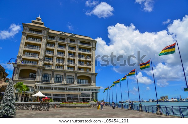 Port Louis, Mauritius - Jan 4,\
2017. National flags at main square of Port Louis, Mauritius. Port\
Louis is the country economic, cultural and political\
centre.