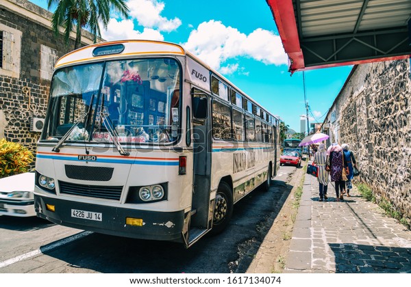 Port Louis,\
Mauritius - Jan 4, 2017. A local bus in Port Louis Dowtown on\
Mauritius Island. Port Louis is the smallest district and certainly\
the warmest town of\
Mauritius.