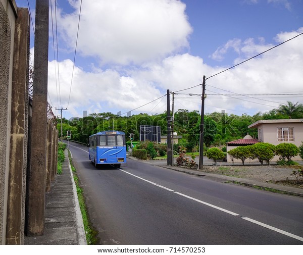 Port Louis,\
Mauritius - Jan 6, 2017. A bus running on rural road in Port Louis,\
capital of Mauritius. Port Louis is the business and administrative\
capital of the island.