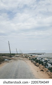 Port Mahon, Delaware Bay Shoreline In The Summer. Sandy  Road With Wide Open Sky