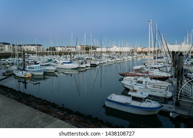 Port and marina of Les Sable D'olonne, France at dusk with reflections in the water - Shutterstock ID 1438108727