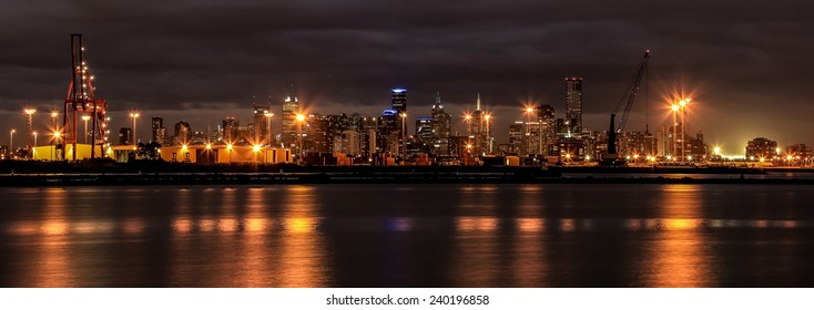 Port Of Melbourne And Melbourne Skyline At Night. 