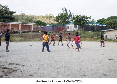 Port Moresby / Papua New Guinea: Group Of Young Boys Playing Rugby On An Esplanade In The Capital Of Papua New Guinea