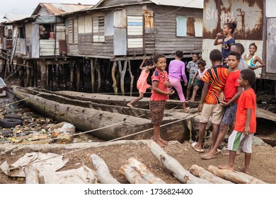 Port Moresby / Papua New Guinea: Group Of Papuan Children Playing In Wooden Floating Village