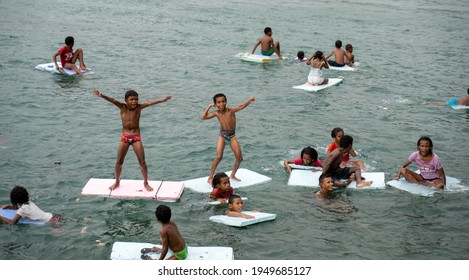 PORT MORESBY, PAPUA NEW GUINEA - December 8, 2020: Hanuabada Kids Playing Outside Of Their Home Village.