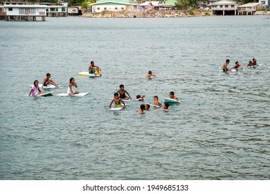 PORT MORESBY, PAPUA NEW GUINEA - December 8, 2020: Hanuabada Kids Playing Outside Of Their Home Village.