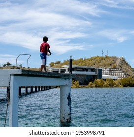 PORT MORESBY, PAPUA NEW GUINEA - December 19, 2020: Trip To Loloata Resort Island. Captured Local Kid Fishing.