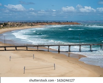 The Port Noarlunga Jetty With Volley Ball Nets In The Foreground In South Australia On 23rd January 2020