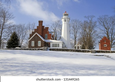  "Port Sanilac Winter" -- All is quiet at the Port Sanilac Lighthouse during a cold but sunny winter's day. - Shutterstock ID 131449265