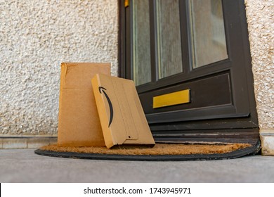 Port Seton, East Lothian, UK - May 28th 2020: Door Step Delivery Of Amazon Parcels.