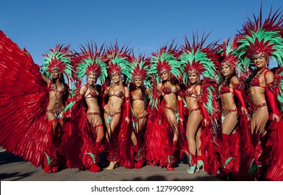 PORT OF SPAIN, TRINIDAD - FEB 12: Female Masqueraders enjoy themselves in the Harts Carnival presentation 'Je Taime Carnival', February 12, 2013 in Port of Spain, Trinidad.