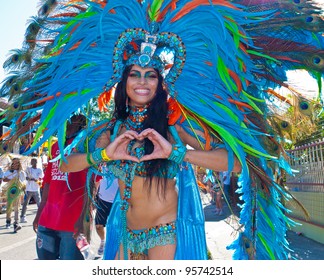 PORT OF SPAIN, TRINIDAD – FEB 2: A Female Masquerader enjoys herself in the Harts Carnival presentation 'Pantheon-wrath of the gods', February 21, 2012 in Port of Spain, Trinidad.
