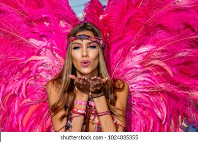 PORT OF SPAIN, TRINIDAD - February 13:  A female Masquerader enjoys herself in the Harts Carnival presentation-Shimmer and Lace-, February 13, 2018 on the streets of Port of Spain, Trinidad.
