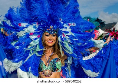 PORT OF SPAIN, TRINIDAD - February 28: A Female Masquerader enjoys herself in the Harts Carnival presentation- Ultraviolet Jungle -, February 28, 2017 on the streets of Port of Spain, Trinidad.
