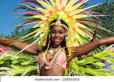 PORT OF SPAIN, TRINIDAD – March 5:  A female Masquerader enjoys herself in the Harts Carnival presentation-Legendary-, March 5, 2019 in Port of Spain, Trinidad.