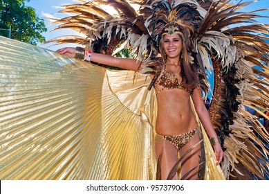 PORT OF SPAIN, TRINIDAD,FEB 21: A Female Masquerader enjoys herself in the Harts Carnival presentation 'Pantheon-wrath of the gods', February 21, 2012 in Port of Spain, Trinidad.