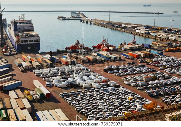 Port terminal with a lot of new cars\
and containers. Business logistic, Water\
transport\
