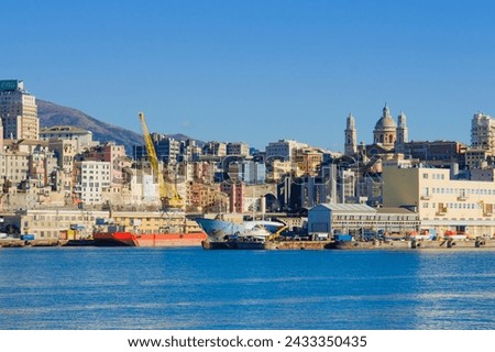 The port, with various vessels and cranes, in Genoa, Liguria, Italy
