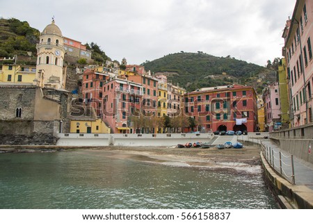 Port of Vernazza with the church of Santa Margherita V.M. and its colorful houses in the coastal Ligure, Cinque Terre, Italy.