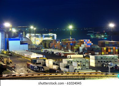Port warehouse with cargoes and containers at night