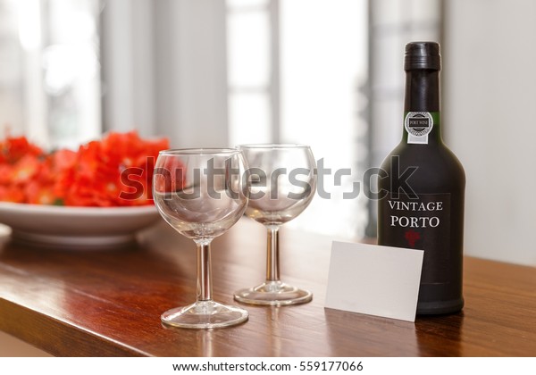 Port wine, glasses and\
a  welcome card