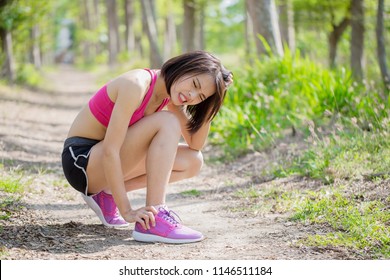 port woman with ankle injury in the forest