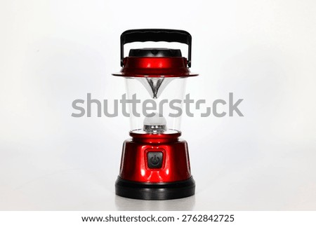 Portable battery-powered camping lantern designed for outdoor illumination, featuring a compact and practical light source ideal for camping, hiking, emergency use, tent lighting, and travel.