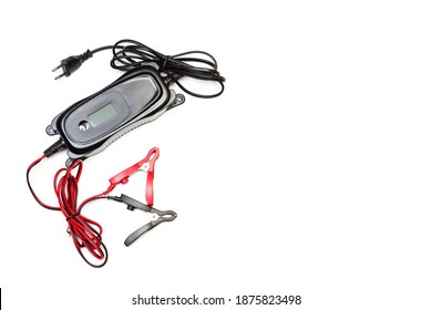 A Portable Car Battery Charger On A White Background With Copy Space