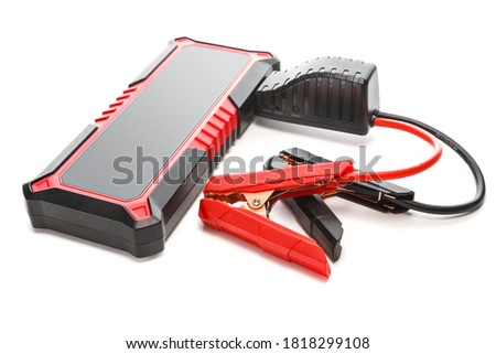 Portable car jump starter. Emergency charger booster Power Bank battery isolated on white background.