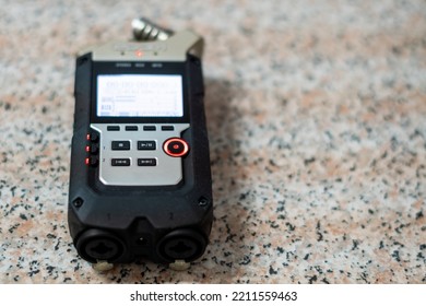 Portable Digital Audio Recorder On Granite Surface.