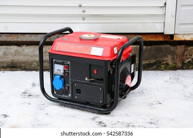 Portable Electric Generator Running In The Cold Winter.