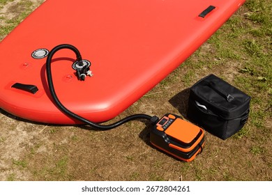 Portable Inflatable Paddle Board Setup with an Electric Pump for Fun On the Water