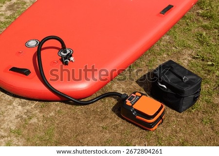Portable Inflatable Paddle Board Setup with an Electric Pump for Fun On the Water