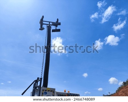 Portable led light tower. Construction site lighting stand with four spotlights.