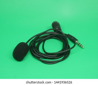 Portable Mini 3.5mm Tie Lapel Lavalier Clip-on Mic On Green Screen, Top View Image.                        