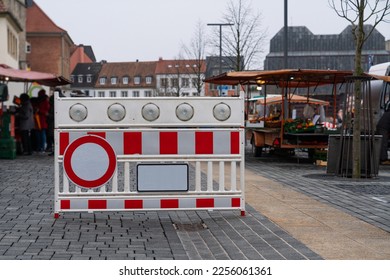 Portable plastic red and white barrier with a stop signal fume resurrecting entry to the peasant market - Shutterstock ID 2256061361