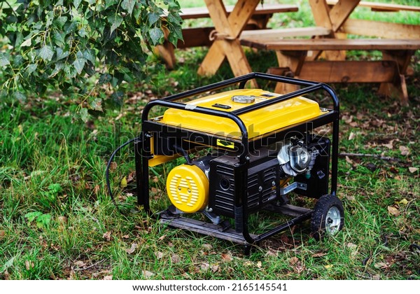 Portable power generator. Compact equipment\
for powering various devices in nature and in places without power\
supply. Selective focus.\
Foreground