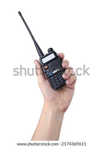 Portable radio transceiver in hand, isolated on white background