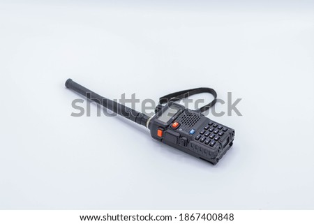 Portable radio transceiver isolated on white background.