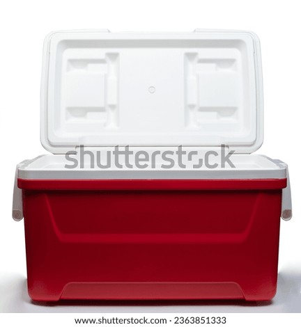 Portable red plastic cooler box open isolated on white studio background