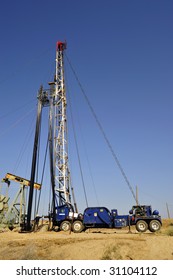 Portable Rig Sets Up To Service Existing Oil Well