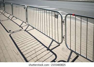 Portable sectional fence. Steel mobile fence on the street. Police fence. - Shutterstock ID 2155483825