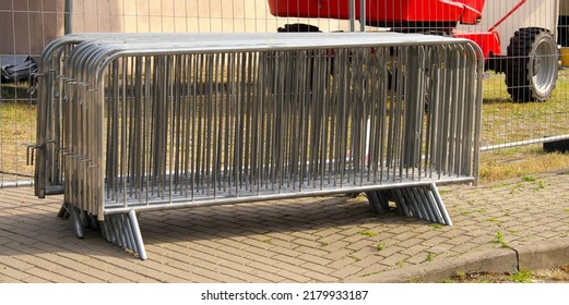 Portable sectional fence. Steel mobile fence on the street. Police fence. - Shutterstock ID 2179933187