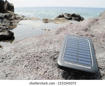 Portable Small Solar Panel near the Atlantic Ocean - Shutterstock ID 2151541073