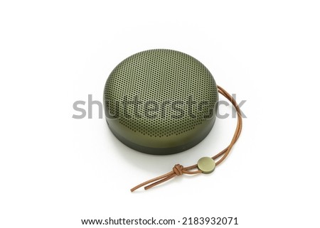 Portable speaker isolated on white background. Product design. Minimalist speaker. Object. Entertainment. Sound and music.