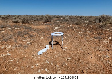 Portable Toilet With Toilet Paper Roll In The Desert. Australia.