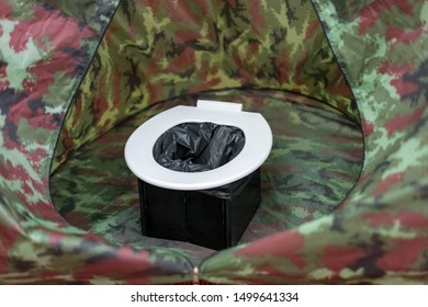 portable toilets in tent at camping public.