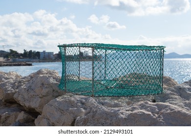 Portable traditional fishing trap for catching octopus, crabs, made of iron bars and green nylon nets, in Dalmatia, Croatia